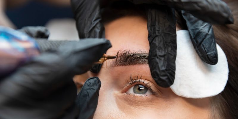 young-woman-getting-beauty-treatment-her-eyebrows